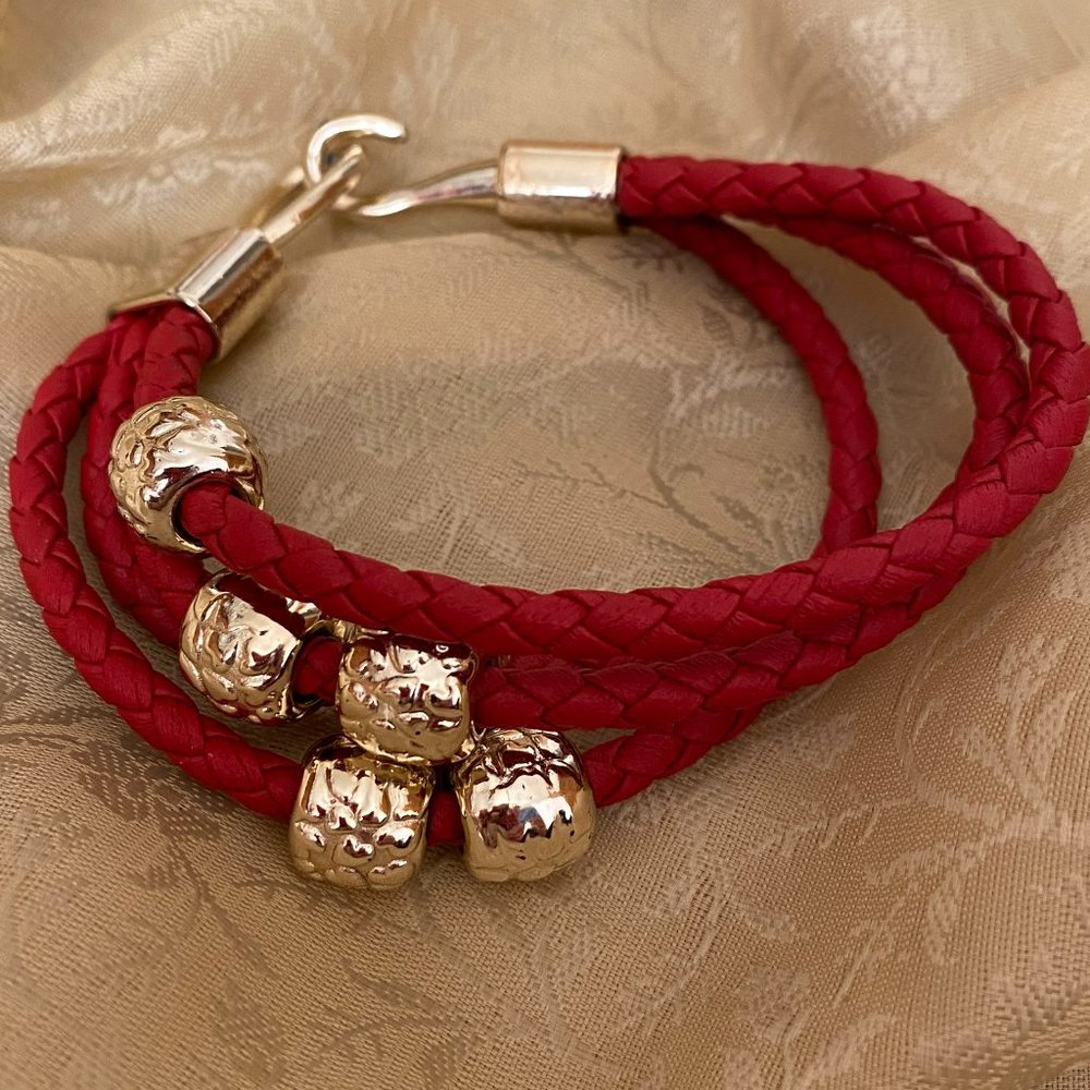 Red rope bracelet with gold accents